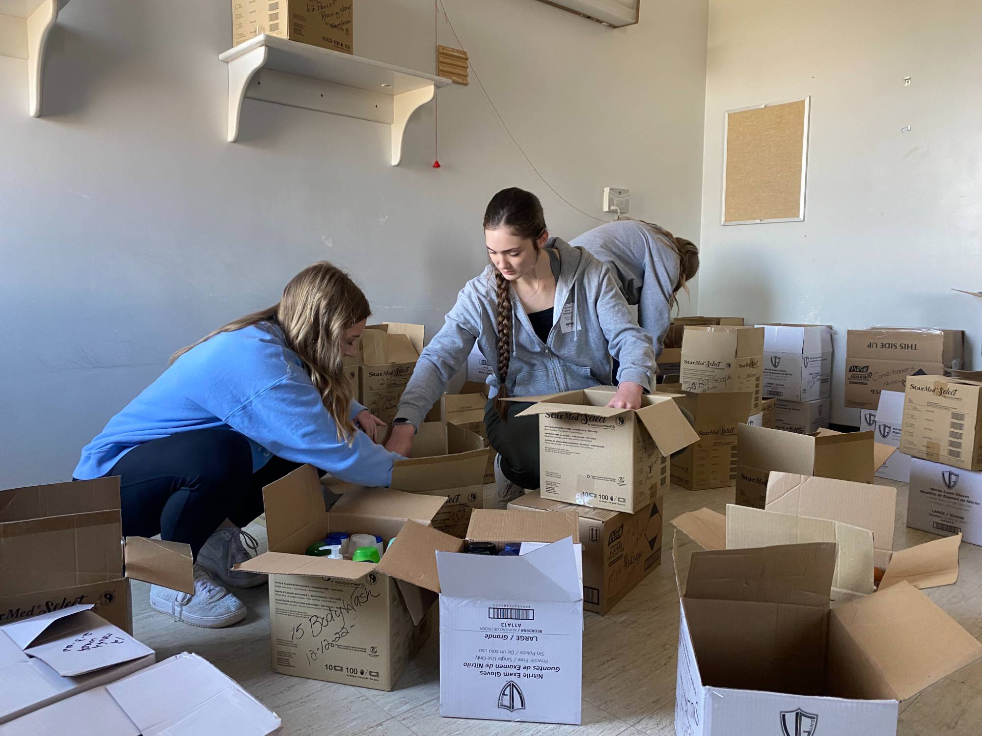 Two Scholars Organizing Boxes